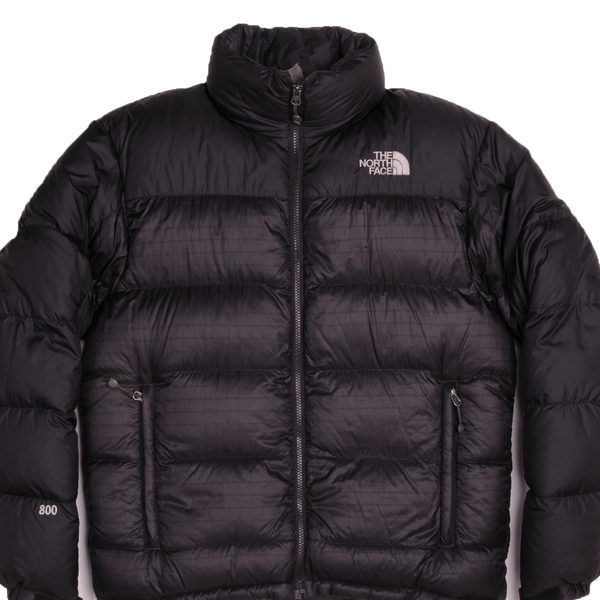 The moment you see the oversized baffles you know you're looking at the iconic Nuptse Jacket. This durable piece has lofty 800-fill down and a sleek.