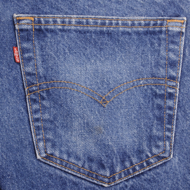 Beautiful Indigo Levis 505 Jeans Made in USA with Medium wash  Size on Tag 33X36  Actual Size 32X36  Back Button #532