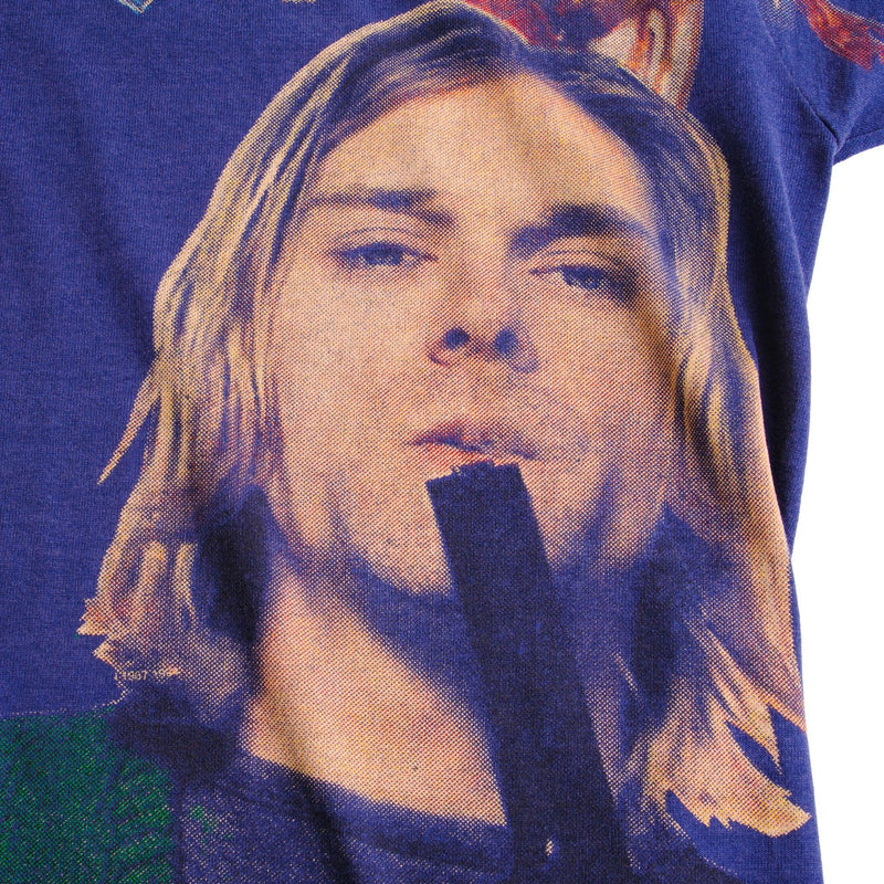 Vintage Blue All Over Print Nirvana Kurt Cobain 1967-1994 Screen Stars Best Tee Shirt Size Large Made In USA With Single Stitch Sleeves.