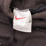 SUDADERA CON CAPUCHA NIKE VINTAGE CON SWOOSH CENTER GRIS OSCURO DE TRAVIS SCOTT, AÑOS 90, MEDIANO, FABRICADA EN EE. UU.