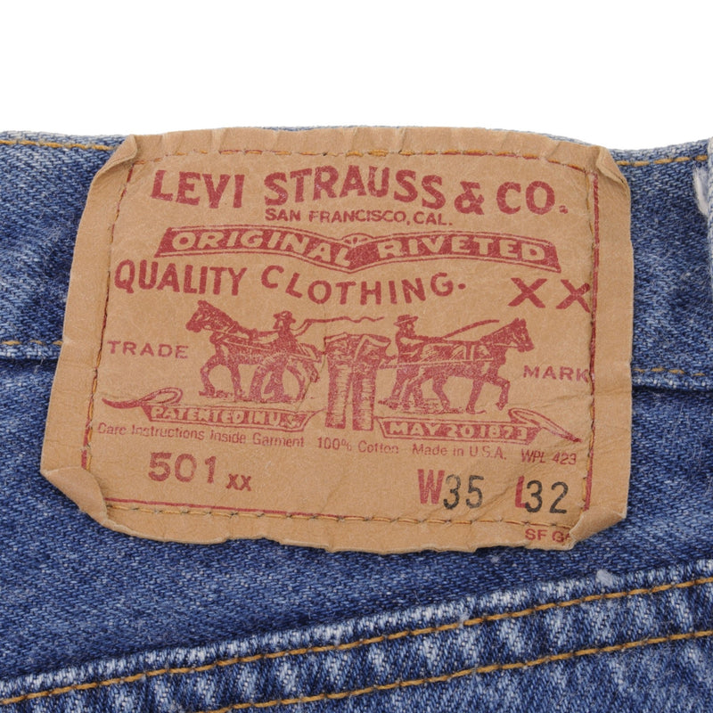 Beautiful Indigo Levis 501 Jeans 1980s Made in USA with Medium Light Wash.  Size on tag 35X32 Actual Size 34X30 Back Button #552